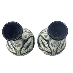 Pair of Moorcroft vases, of waisted baluster form, decorated in the Rain Daisy pattern designed by Rachel Bishop, with impressed and painted marks beneath, and dated 2004, H13.5cm. 