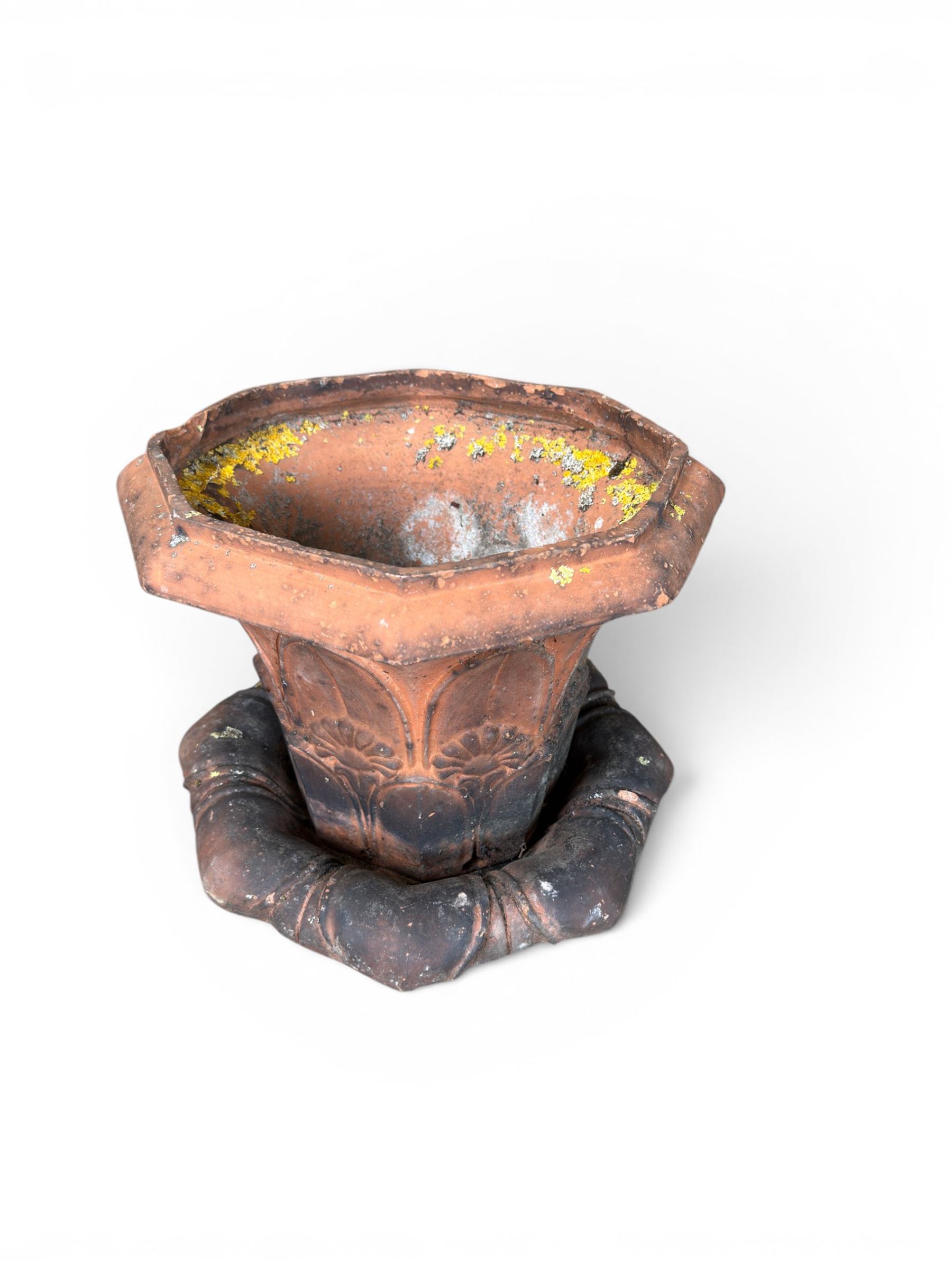 Small 19th century terracotta octagonal planter with stand, flower and leaf design