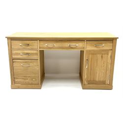 Light oak twin pedestal computer desk, one central long drawer flanked by two short drawers, above graduating drawers and cupboard
