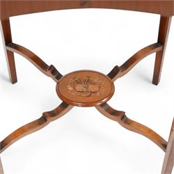 Edwardian satinwood kidney-shaped bijouterie table, hinged lid with glazed panel enclosed by floral painted frame, on square tapering supports decorated with trailing bell flowers, united by shaped stretchers and oval tier painted with ribbon and trumpets 