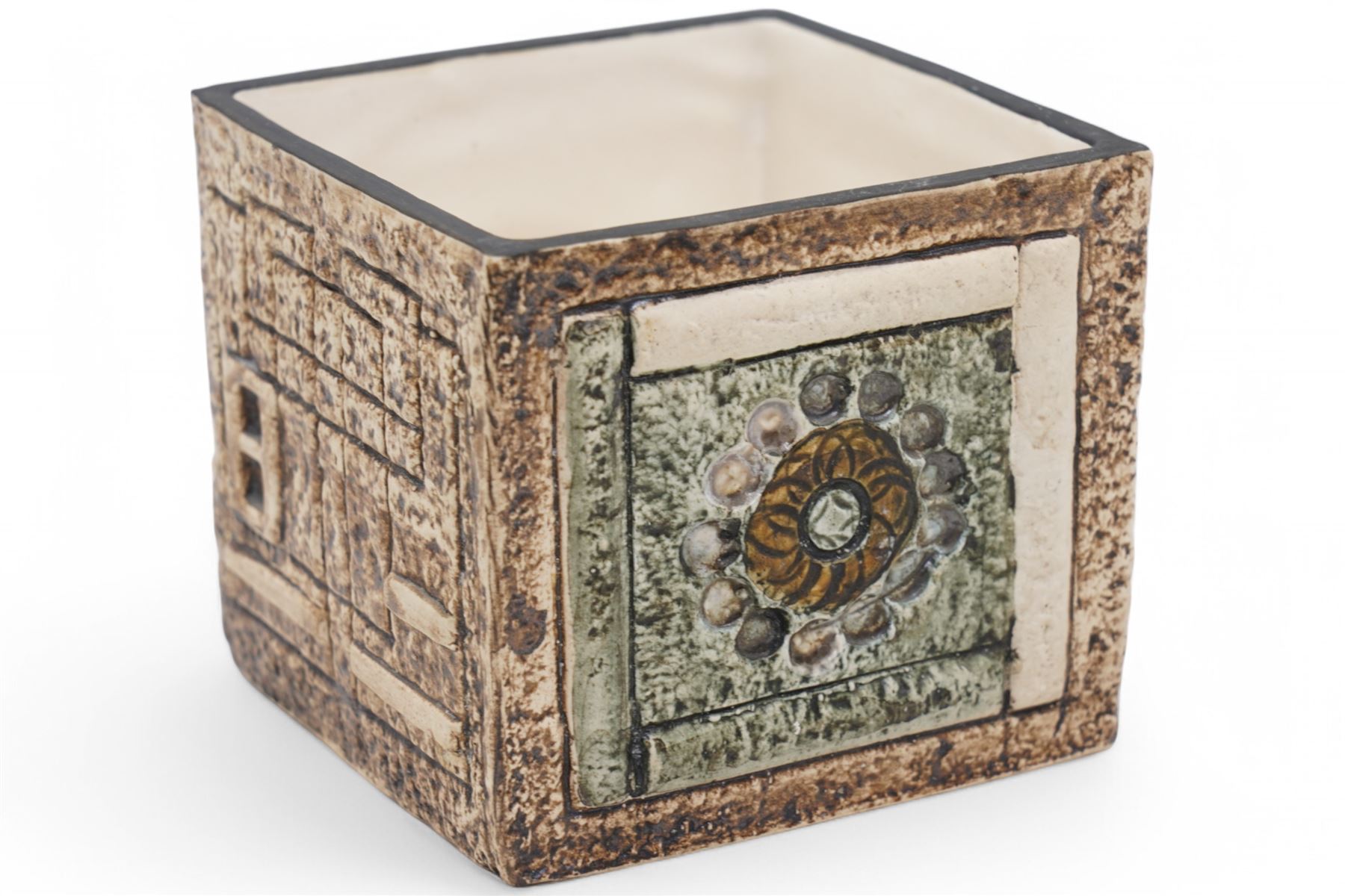Troika cube vase, with incised geometric decoration in green and cream on a mottled light brown ground, signed to base with initials for artist Shirley Wharf, H8.5cm