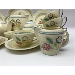 Susie Cooper Nosegay pattern tea service, teapot, eight cups and saucers, six dessert plates, three graduating jugs, covered twin handled sucrier, open sucrier  and cake plate 