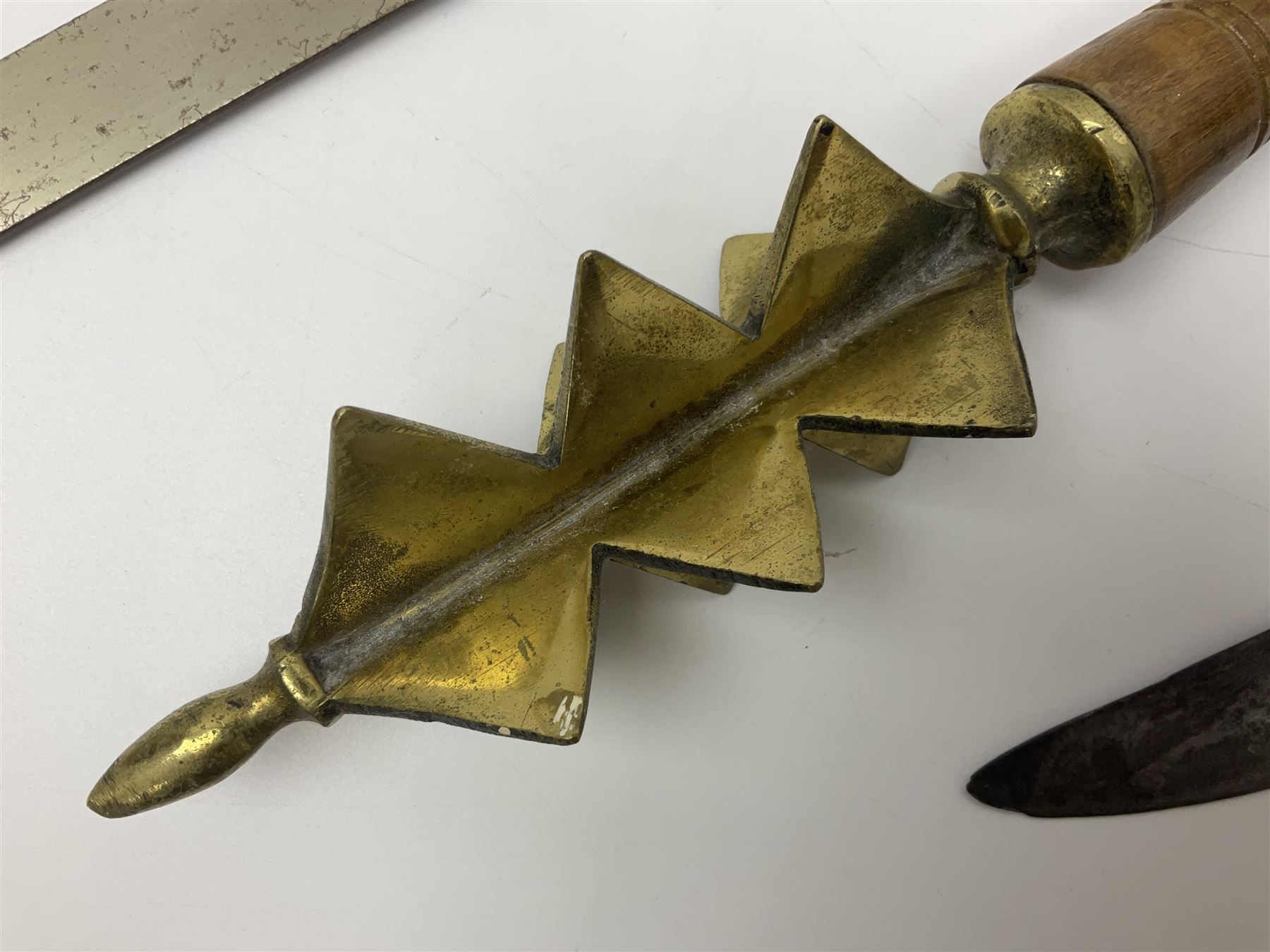 Near pair of short swords each with slightly curving 41cm fullered steel blade and all brass H-shaped hilt L52cm overall; plaited black leather whip; and reproduction pair of brass hilted swords, brass halberd blade and mace (7)