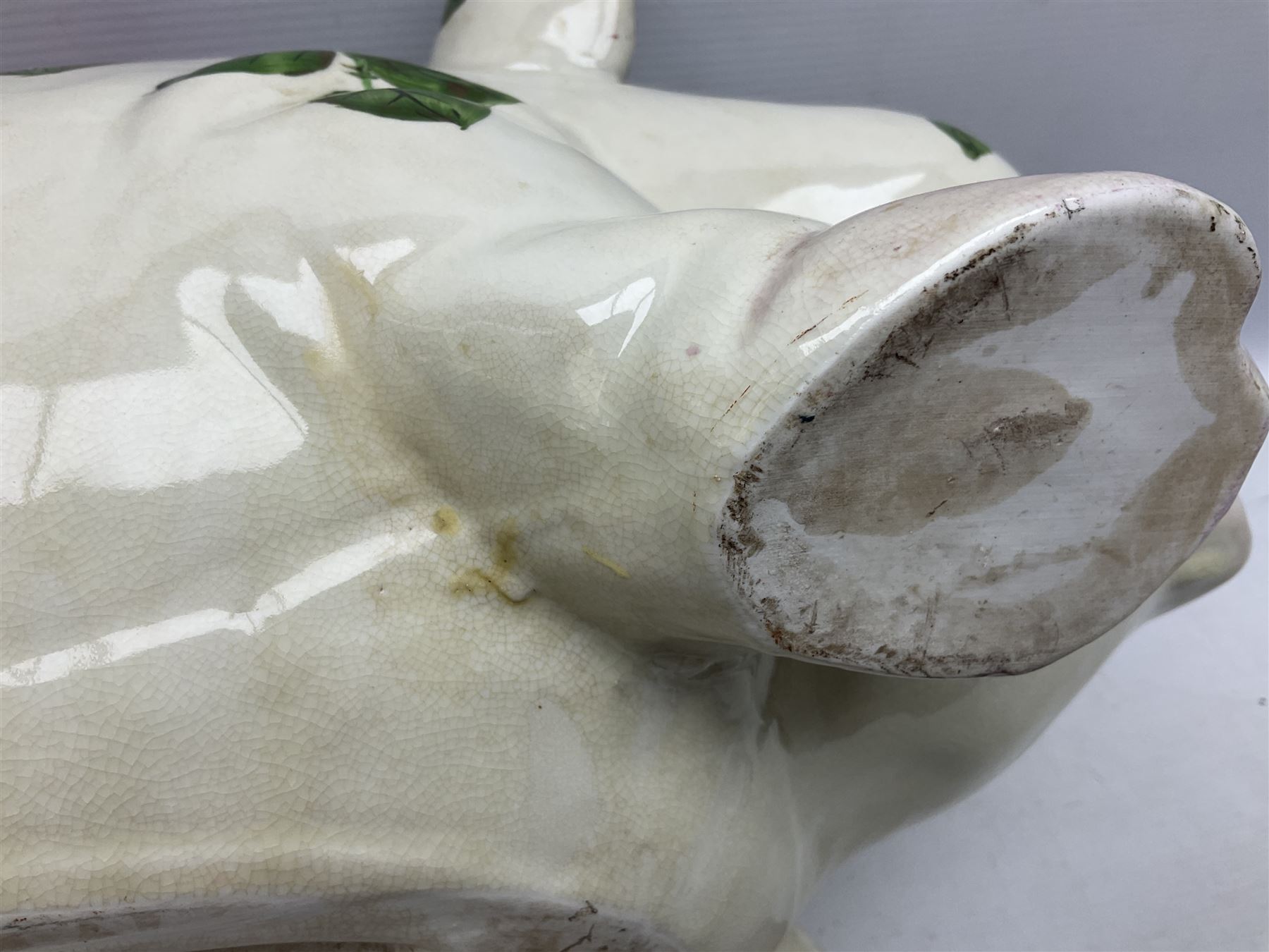 Large ceramic figure of a pig decorated with roses, L45cm