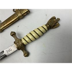 WW2 German kreigsmarine style dagger composed from various age parts, the post-war 25cm double fullered blade  with etched decoration and inscribed WKC with knight's head; in gilt brass scabbard with two rings L42cm overall