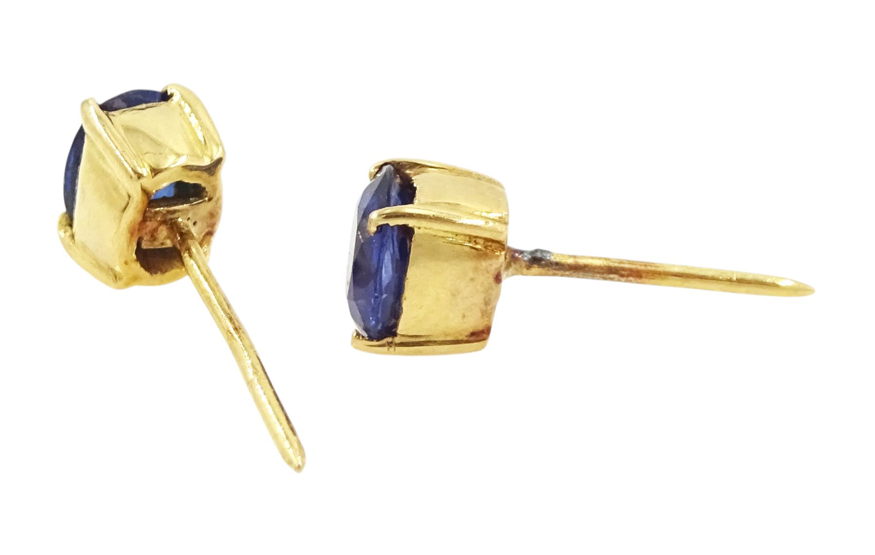 Pair of 18ct gold sapphire earrings, each stud set with a single oval cut sapphire, total sapphire weight approx 0.60 carat