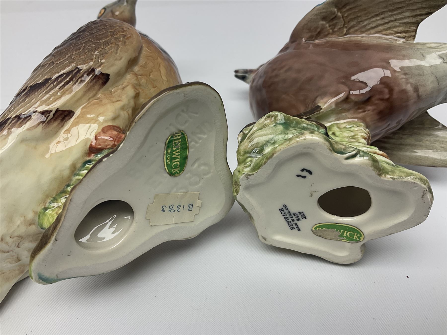 Collection twenty one of Beswick bird figures, to include Lapwing no 2416, Kingfisher no 2671, Red Pigeon 1383, Cuckoo no 2315, Nuthatch no 2418 etc