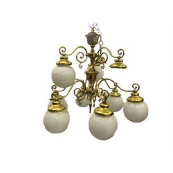 Two tier brass plated nine branch light fitting, with decorative scroll work 