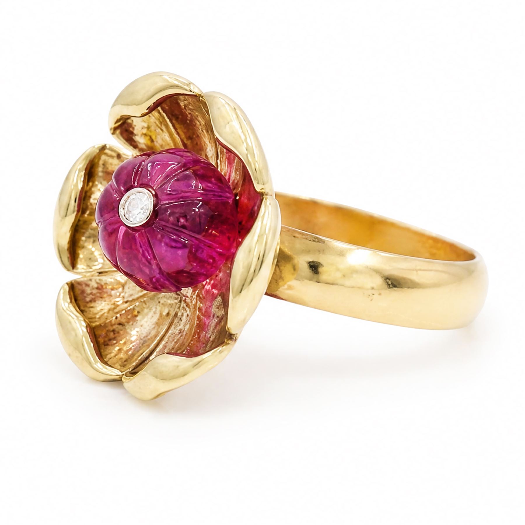 14ct gold ruby and diamond flower head ring, carved ruby set with a single round brilliant cut diamond, on a 9ct gold shank, hallmarked