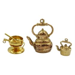 18ct gold fondue pendant/charm, stamped 750 and two 9ct gold kettle pendant/charms, hallmarked