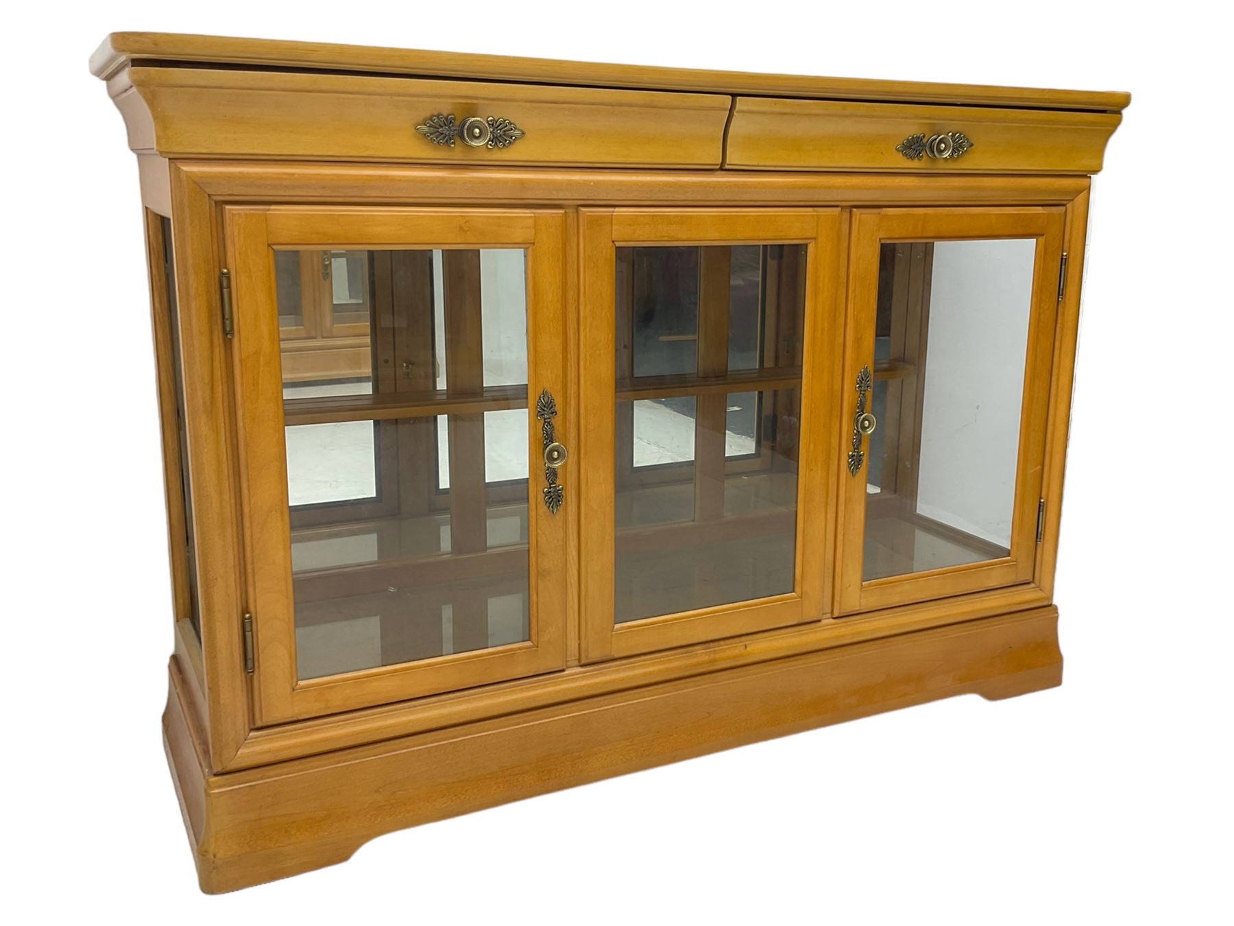 Yew wood sideboard, rectangular top with mahogany and ebony stringing, fitted with two drawers over three glazed cupboard doors enclosing glass shelves