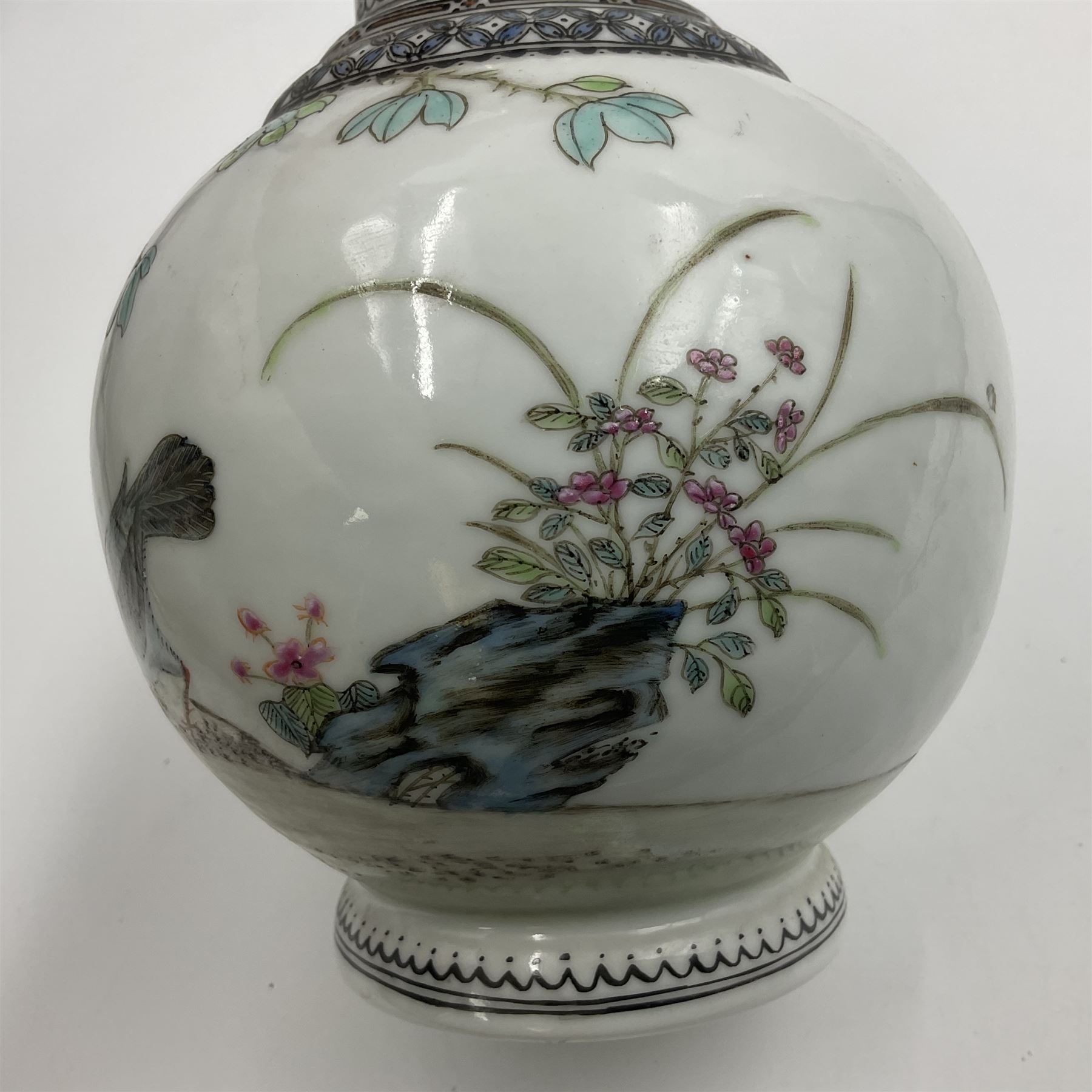 Pair of Chinese Republic porcelain vases, each painted in Famille Rose enamels with pairs of pigeons amidst peony, rock, flowering plants and leafy branches, possibly Qianlong seal beneath, H22cm 
