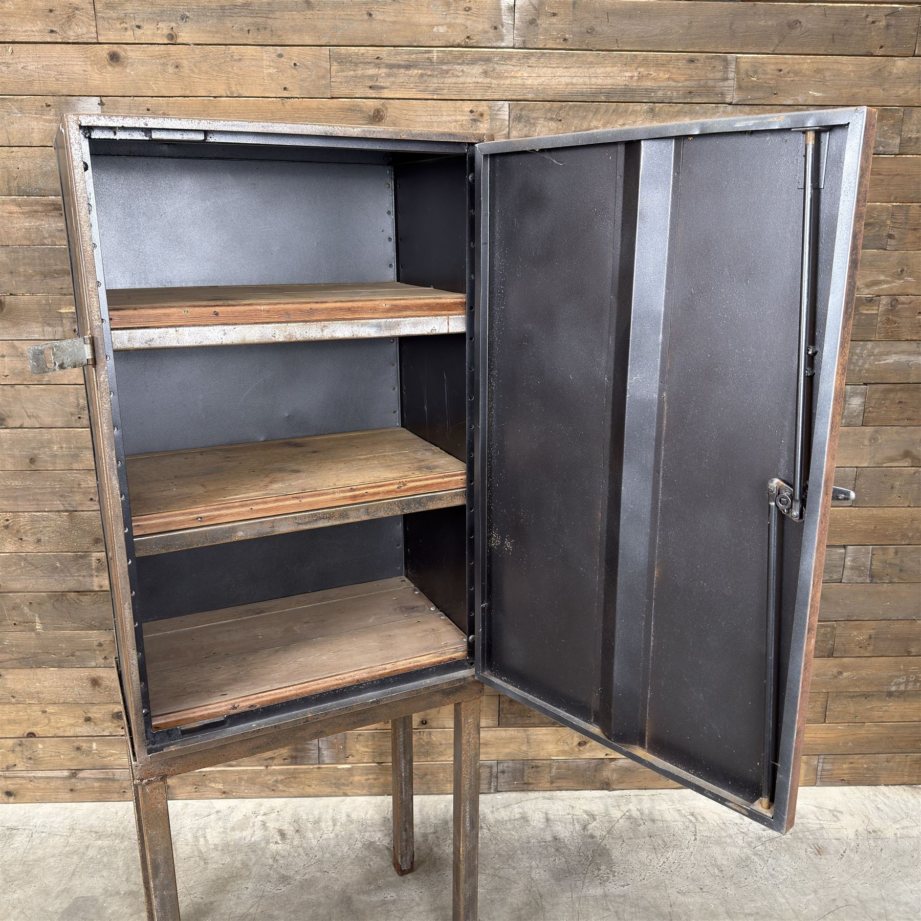 Luxor - industrial modular cabinet, three sections comprising single drawer, double drawer and single cupboard, raised on stand; and a tall industrial cabinet