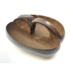  A Coco-de-mer seed (Lodoicea maldivica), carved as a basket, W8cm L31cm.    
