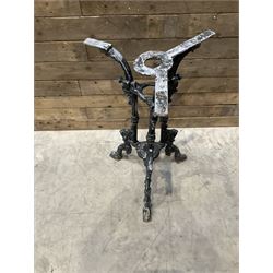 19th century cast iron table base, trefoil column with paw feet