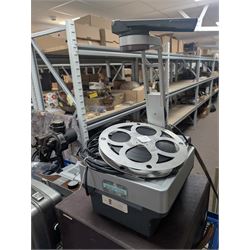 Collection of projectors, including Transpaque Junior overhead projector, Demo Comm 1 overhead projector, Bolex 18-9 Duo, Bolex 18-5, Pathescope Kid, Kodascope Model C, collection of video tapes and film reels, empty projector box, Kinay 816 editor, etc