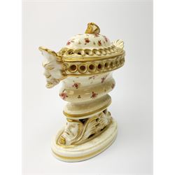 A small Grainger & Co Worcester por pourri and cover, circa 1805-1811, of oval form with twin mask handles and conforming mask detailed base, decorated throughout with painted flowers, inscribed beneath Grainger & Co Worcester, H13cm. 