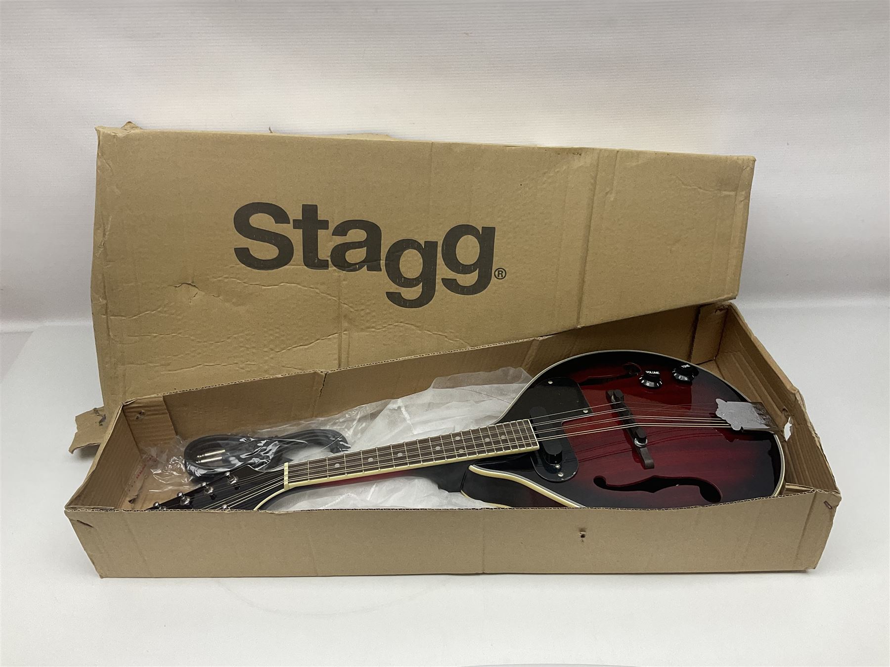 Stagg Model M50 E eight-string electro-acoustic mandolin; bears makers label L69cm; in cardboard delivery box with lead