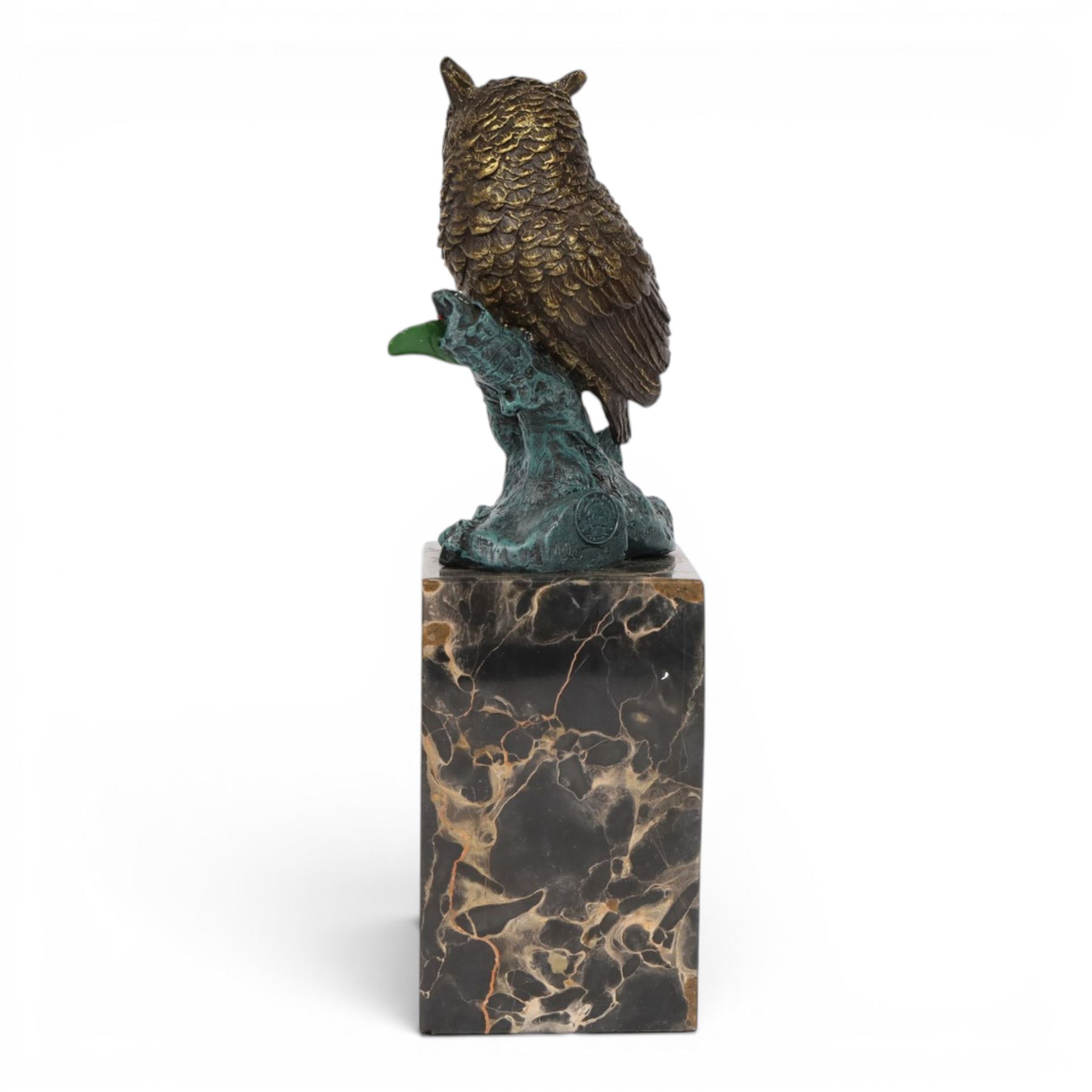 Cold painted bronze figure, modelled as an owl perched upon a tree stump signed Milo and with foundry mark, raised upon black veined marble plinth, H27.5cm