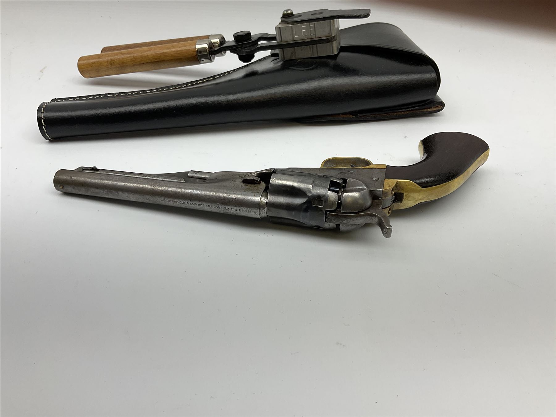 Colt .36 calibre percussion five-shot police pocket revolver, all parts with matching serial no.18334, 14cm barrel marked 'Address Col Saml Colt New York US America' with under barrel swivel rammer, brass trigger guard and backstrap with two-piece wooden grips L28.5cm; with modern bullet maker and leather holster.