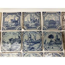 18th century Dutch Delft tiles painted in blue and white and manganese, decorated with buildings in landscapes, seascapes and figures, all within foliate spandrels, H13cm (27)