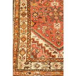  Oriental beige ground rug, central medallion, repeating border, 210cm x 102cm  