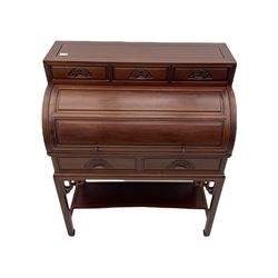 Hardwood cylinder desk, three drawers raised over curved lid, fitted interior with slide, the supports joined by undertier with fret work brackets 