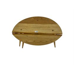 Ercol - elm and beech '308 Folding Occasional Table', circular top with gate-leg and splayed tapering supports