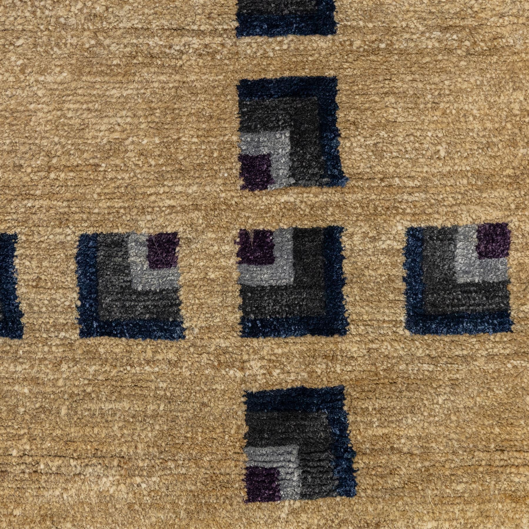 Rugs by Design - ‘Silk Stone’ Nepalese thick pile wool rug, with plain textured camel ground and geometric border detail in blue, grey and dark tones to two sides