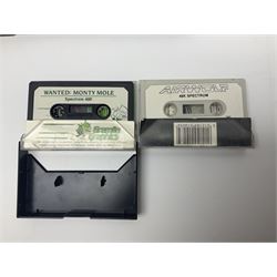 Sinclair ZX Spectrum (1984) with accessories and games; ten games for Sinclair Spectrum and 48K Spectrum to include ‘Knight Lore’, ‘The Way of the Exploding Fist’, and ‘Green Beret’ all in original boxes, ‘Rambo First Blood Part II’ without original box; Sinclair UK1400 Power Supply Unit, Hales Universal Mains Adapter, RAM Turbo Spectrum Joystick Interface, Starlite Cassette Player, all without boxes