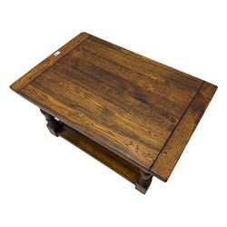 Traditional oak two tier coffee table, turned supports united by under-tier