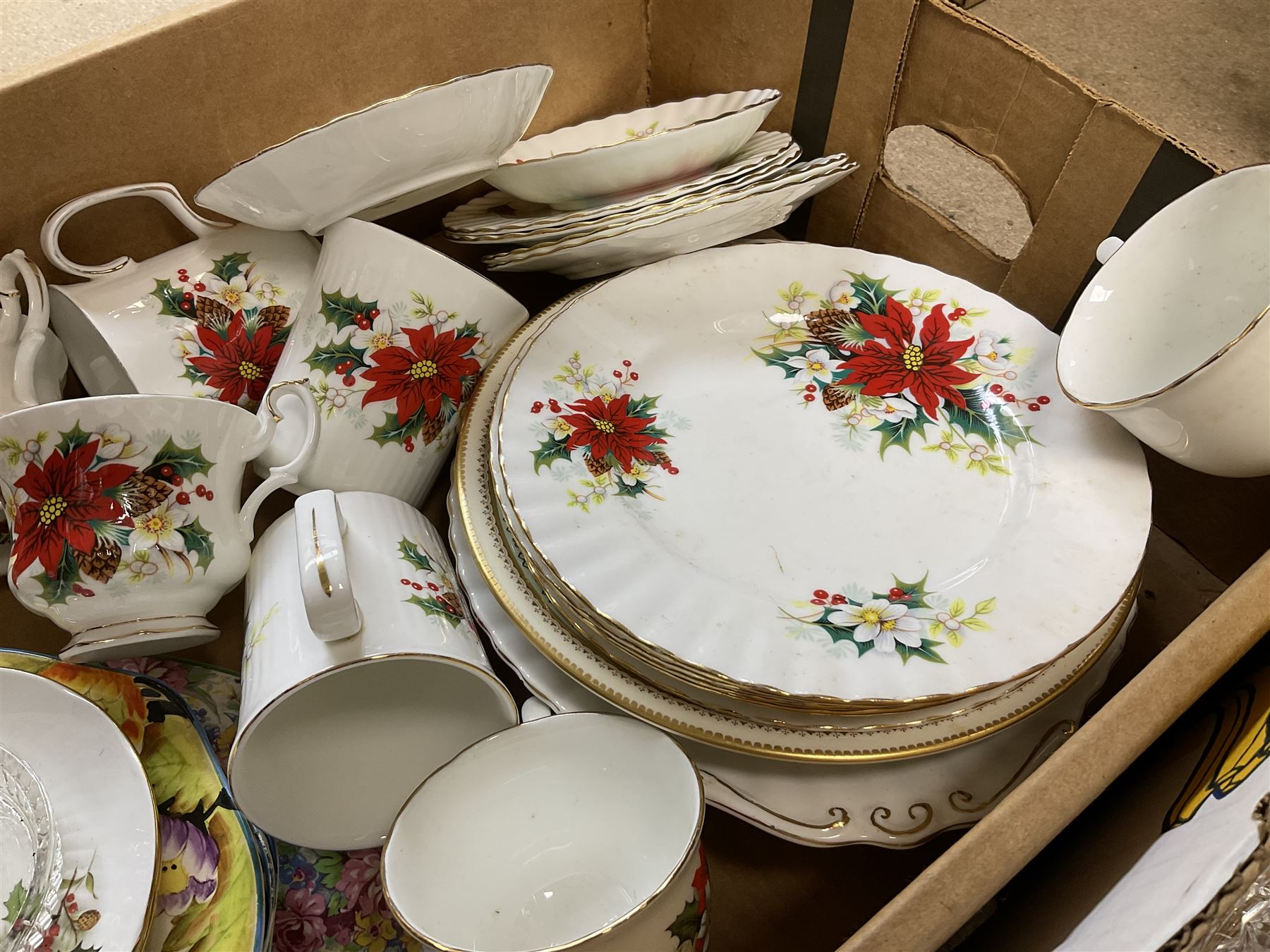Royal Albert Poinsettia pattern part tea service, including tea cups, mugs, dessert plates, cake plate, together with James Kent plates, Crown Staffordshire Vermouth ceramic decanter label, glassware etc, two boxes 