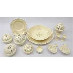  Sixteen pieces of modern pierced creamware by Hartley Greens & Co, Authentic Leedsware and Royal Creamware comprising  two-handled oval dish on stand, four plates, two tea strainers (one stand), five lidded bowls and pair of egg cups  
