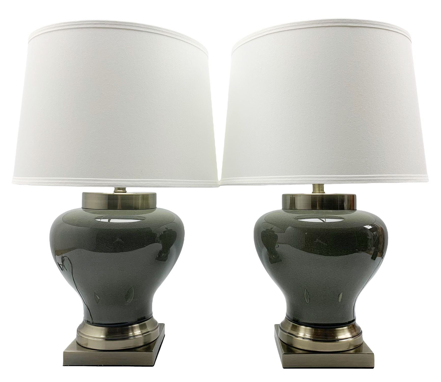 Pair of Chinese porcelain lamps, each of squat baluster form, decorated with a smokey crackle glaze, raised upon square brushed bronze base, H58cm including shade