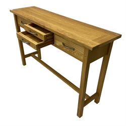 Solid light oak console table, fitted with four drawers