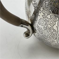 Late Victorian silver bachelors three piece tea service, comprising bullet shaped teapot, open sucrier and milk jug, each engraved with monogram surrounded by birds upon and amidst a blossoming vine, the teapot with scroll capped curved wooden handle and wooden finial to cover, hallmarked Wakely & Wheeler, London 1890, teapot including handle H12cm, sucrier H5.5cm 