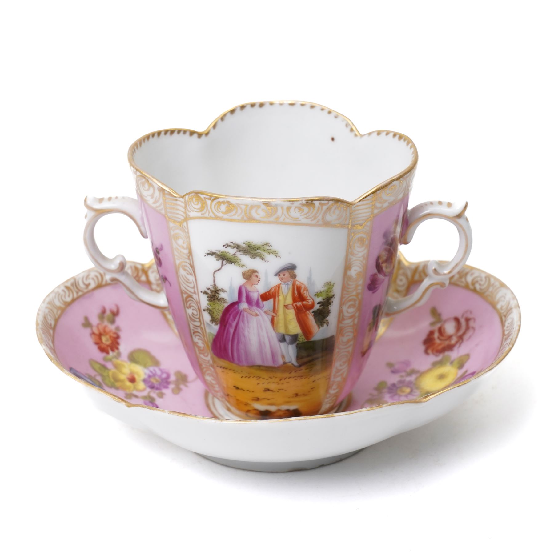 Two 19th century Dresden quatrefoil twin handled chocolate cups and saucers, decorated with Watteau style panels, with pink and yellow floral ground and gilt heightened decoration, blue 'AR' mark to underside for Helena Wolfsohn (2)