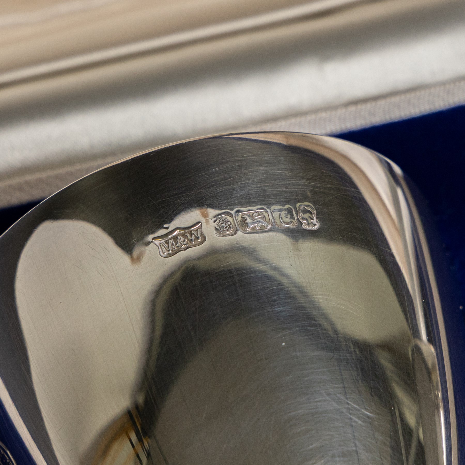 Pair of limited edition commemorative silver goblets, each engraved with HRH Queen Elizabeth's Royal cypher, the bowls with gilt interior and upon a parcel gilt stem, the circular foot engraved 'The Queen's Silver Jubilee 1952-1977', both hallmarked Mappin & Webb Ltd, Sheffield 1977, limited edition numbers 267 & 268/2500, boxed, H17cm
