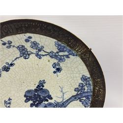 20th century Chinese blue and white crackle glaze charger, decorated with peonies, prunus blossom, and rockwork, within simulated bronze border, with character mark verso, D34cm