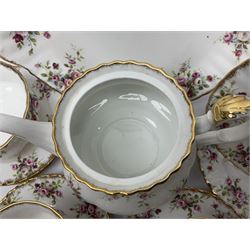 Royal Albert Cottage Garden pattern tea service for six people, comprising teapot, milk jug, sugar bowl, teacups and saucers, side plates and cake plate, all with printed mark beneath
