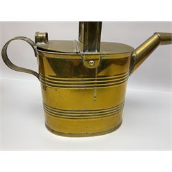 Set of two graduating brass watering cans, tallest H30cm