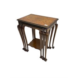 Mid-20th century figured walnut nest of three tables, rectangular tops with foliate moulded edge, on acanthus carved cabriole supports with ball and claw feet, the smallest with undertier 