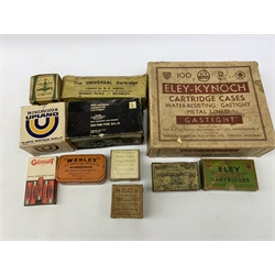 Brass and tin powder magazine by B.E. Chaplin of conical form with glazed see-through nozzle H27cm; eight reprinted gun case labels for Holland & Holland, Thomas Jackson & Son, William Ling, Watson & Hancock, Williams & Powell etc; and quantity of empty cartridge boxes and pellet tins
