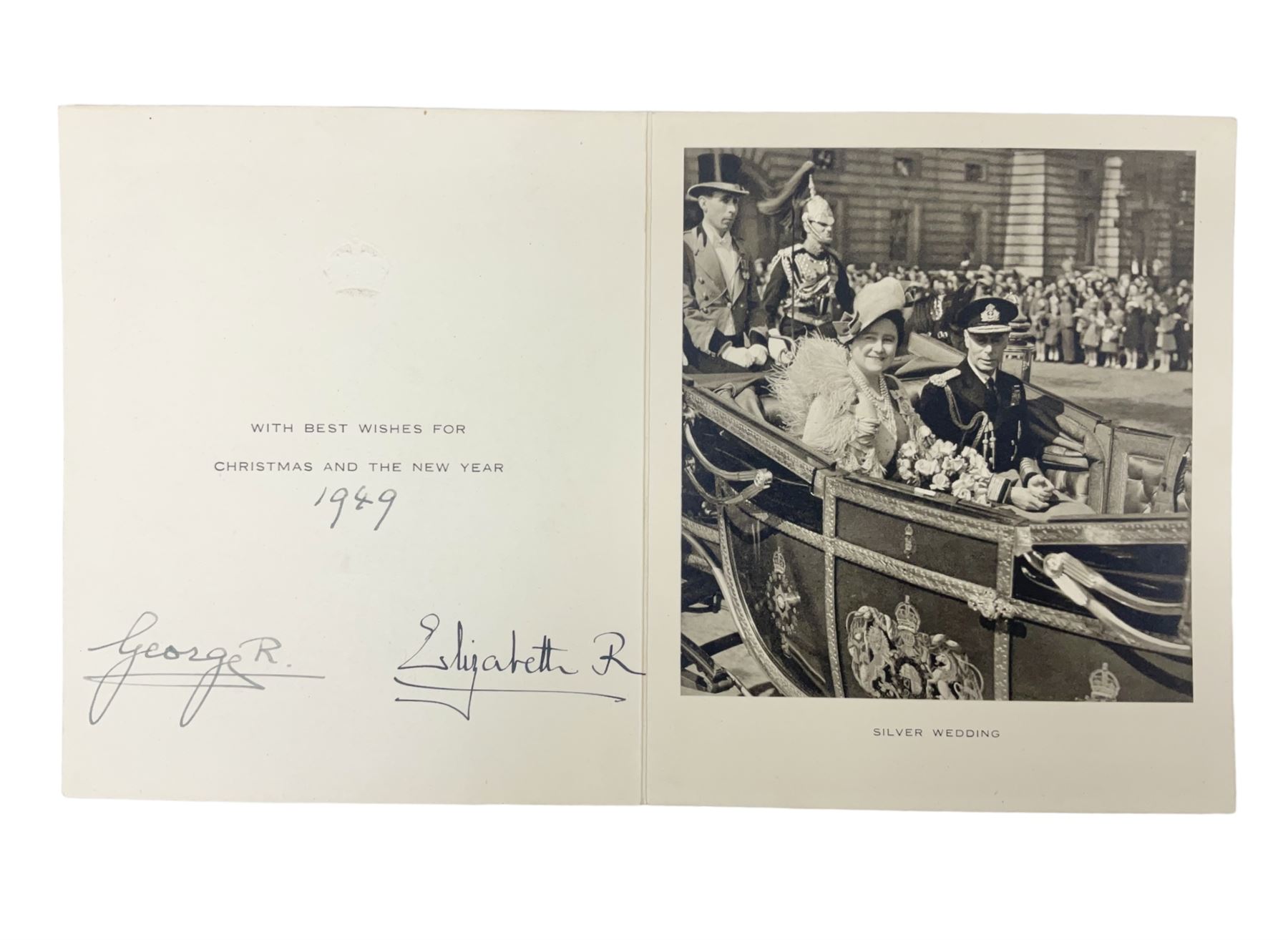 King George VI and Queen Elizabeth - signed 1949 Christmas card with gilt embossed crown to cover, black and white photograph to the interior, of The King and Queen riding in an open carriage to their Silver Wedding Celebration, signed 'George R. Elizabeth R.'