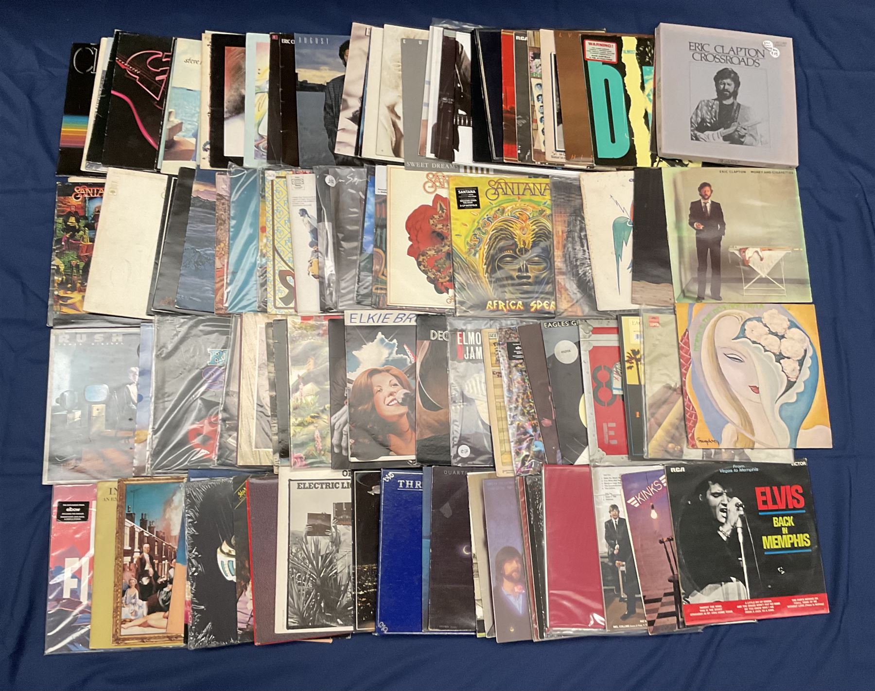 Quantity of vinyl records including Eagles 'Desperado', Electric Light Orchestra 'Balance Of Power', Rush '2112', 'Moving Pictures', Santana 'Festival', Eric Clapton 'No Reason To Cry' and other music, approximately 90, in one box