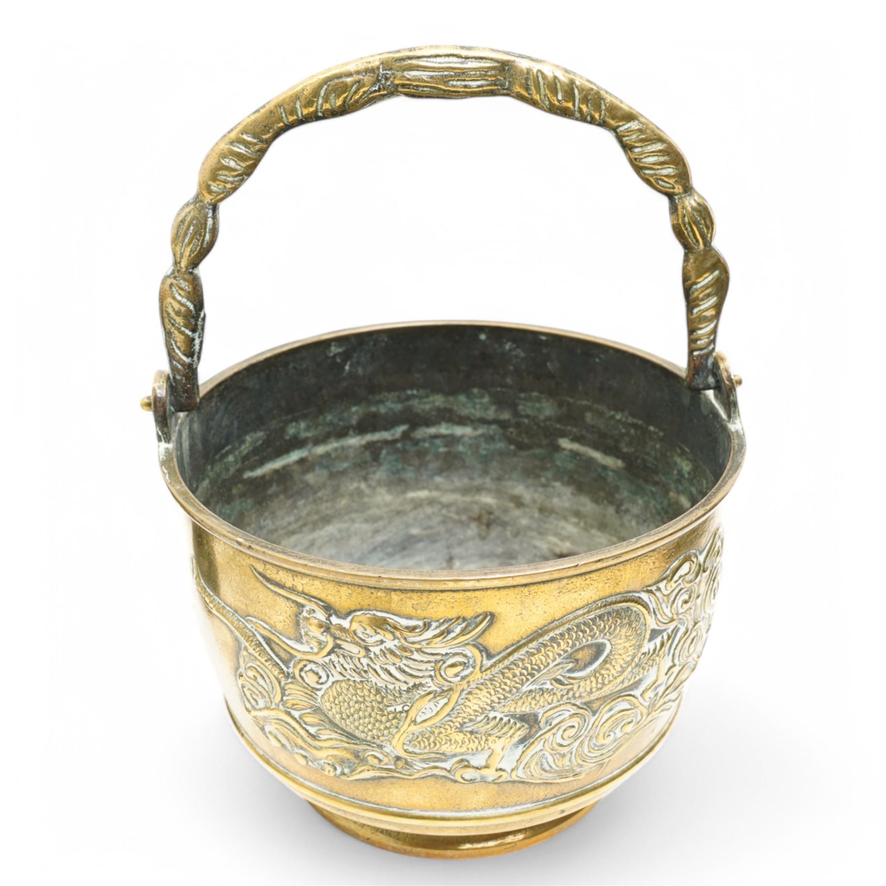 Chinese 20th century polished bronze rice pot with swing handle and raised pattern of dragons D18cm, Meiji period Japanese bronze two handled vase H13cm and a Chinese porcelain bowl from the Tek Sing cargo D15cm (3)