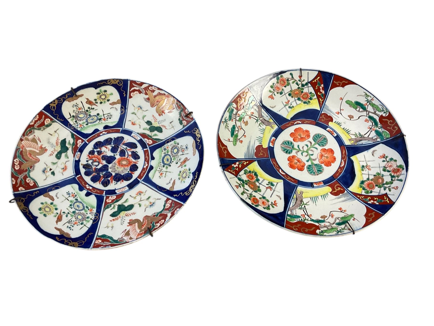 Two Japanese Imari chargers, decorated with reserves of flowers and birds, each approximately D36.5cm
