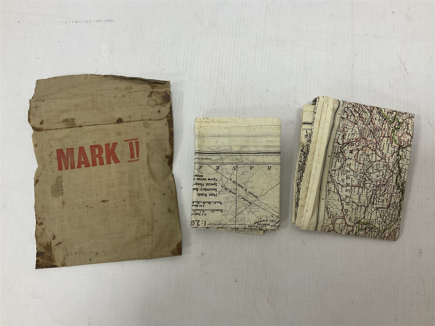 Two WW2 double sided silk escape and evade maps of Europe, comprising: Germany, Belgium, France, Holland, Spain etc,  in canvas envelope stamped Mark II