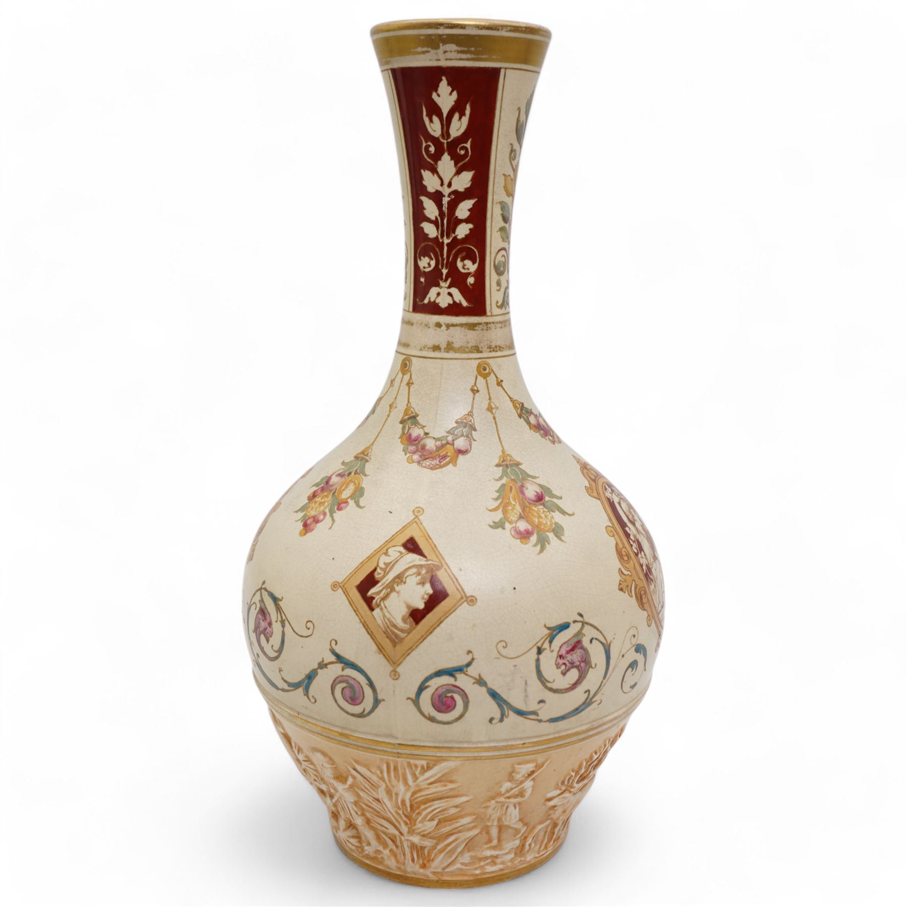 Wedgwood Persian vase by Thomas Allen, of baluster form with elongated neck, decorated to the base with embossed scenes of elephants and chariots, the body with painted over printed designs, impressed marks to base, H34cm 