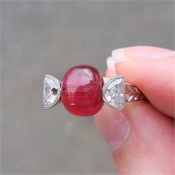 18ct white gold pink tourmaline and diamond ring, single oval cabochon cut tourmaline of approx 4.75 carat, set with a half moon cut diamond either side, to engraved laurel leaf design shoulders